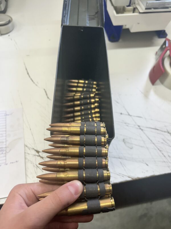 8mm Mauser dummy rounds. 100 round linked belt.